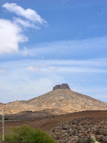 Mountain with a rock on top, formed by erosion. Boa Vista Island, Cape Verde, Cloudy.