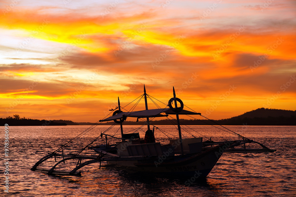 Fototapeta premium Sunset in Balabac Island, located at the southernmost tip of Palawan, Philippines, is a remote, 