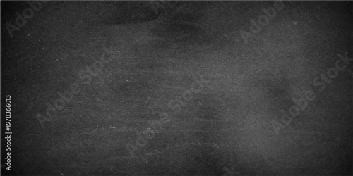 An evocative, tactile close-up view of a chalkboard, its dark surface carrying the subtle texture of past lessons and creative endeavors.