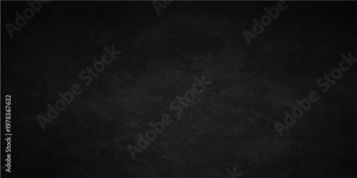 A dark and textured charcoal-toned backdrop, a versatile canvas for design.