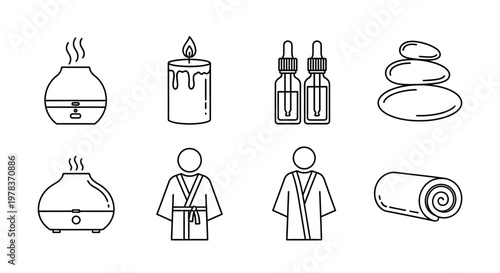 A serene spa scene with a person wearing a bathrobe standing near an essential oil diffuser and a lit candle with stones and toiletries nearby.