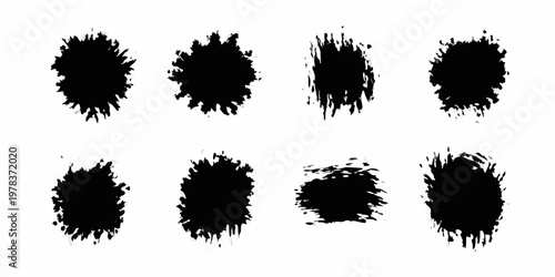 Collection of eight abstract black ink splatters on a white background