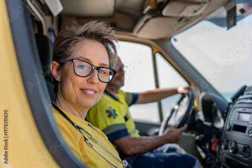Φωτογραφία Paramedics driving ambulance on a sunny day