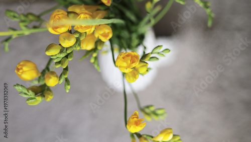 Bright Yellow Freesia Bouquet In Vase