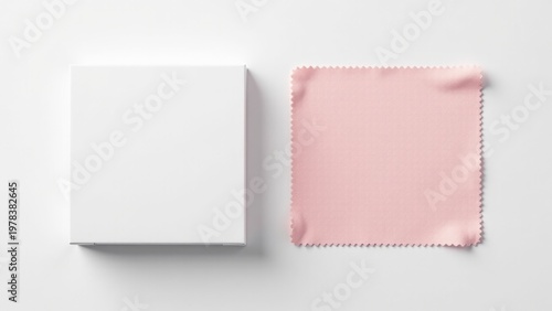 Wallpaper Mural A pink cloth lying flat on a white surface with a white box in the background Torontodigital.ca