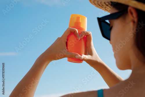 Close up sun cream on hands. Sun protection.  Skin and Body Care. Girl Using Sunscreen to Skin. Portrait Of Female Holding Suntan Lotion and Moisturizing Sunblock.
