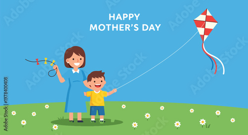 Happy mother and son flying kite in green field with daisies on blue sky celebrating happy mothers day