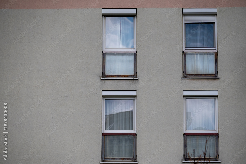 Obraz premium Apartment windows on concrete facade