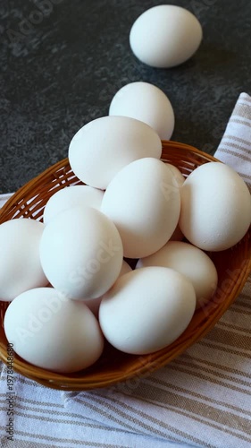 Fresh white eggs gathered in a rustic basket ready for a delightful meal in a cozy kitchen