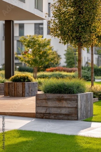 Modern garden design with wooden planters, green grass, and trees in a residential area, showcasing landscaping under sunlight in the daytime
