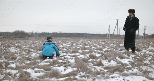 Man and kid boy go for walk. Dad and son play outside. 4K 10-bit