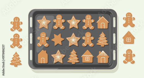Baking tray filled with freshly baked gingerbread cookies in various shapes like men stars trees and houses for the holidays.