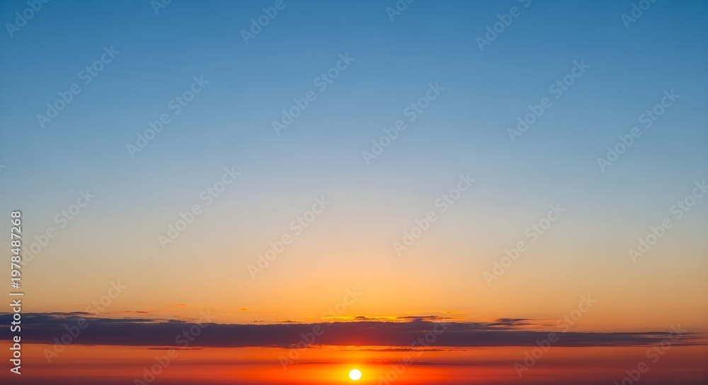Obraz premium vibrant sunset with orange sun and blue sky