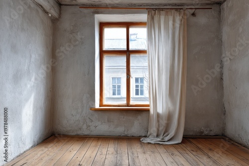 Empty room with wooden floor and window with light curtain.