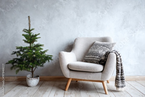 Cozy armchair with Christmas tree and patterned blanket by textured wall.