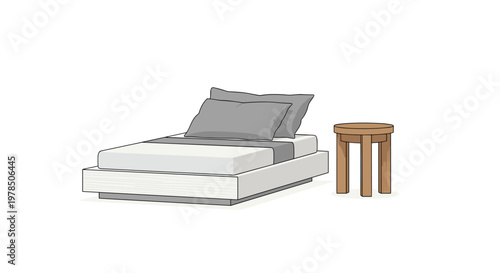 Low-profile modern bed dressed with soft grey pillows and a matching runner sits elegantly next to a small round wooden stool in a minimalist bedroom.