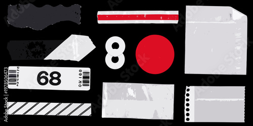 Assorted paper and plastic fragments arranged on a black background