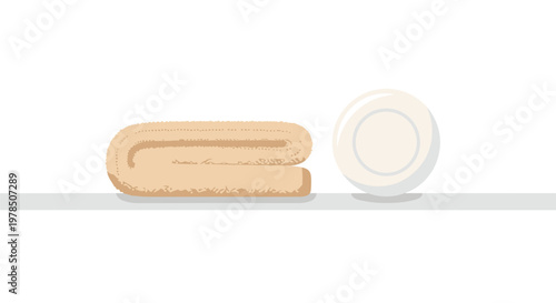 A soft beige folded towel rests beside a simple white ceramic soap dish on a clean horizontal surface in a bright and minimalist bathroom setting today.