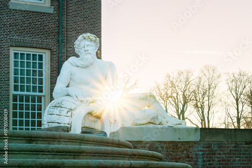 Sunburst pierces ancient stone, casting long shadows on brick walls.