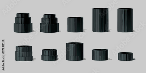 Arrangement of black cylindrical objects with varying heights and stacked forms