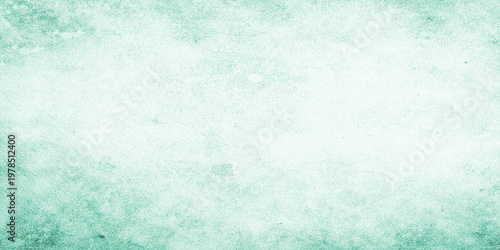 Abstract blue grunge background featuring a vintage turquoise watercolor texture with a rough paper pattern and dirty paint design on a blank old wall surface