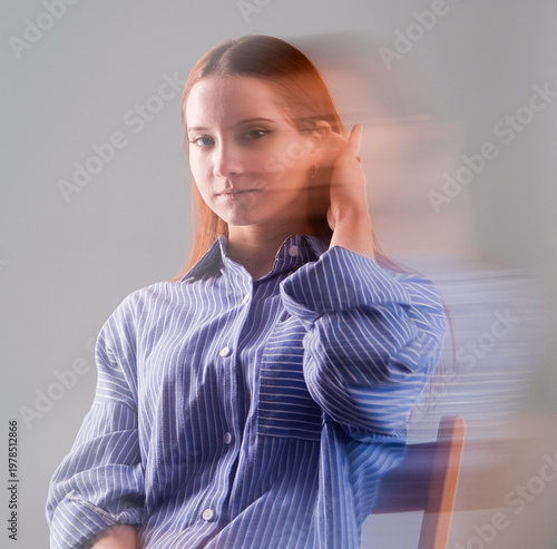 Fashion portrait with the effect of blurring in motion at a long shutter speed