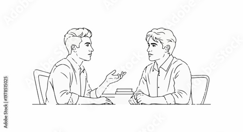 Two young men in shirts sit at a table, talking and gesturing