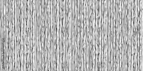 A close up view of tightly packed vertical wooden fence pickets