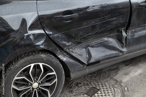 Foto Damaged car door after collision with dents and scratches, auto accident and ins