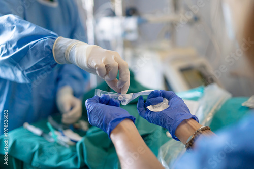 Tableau sur toile Medical team preparing sterile equipment for surgery procedure