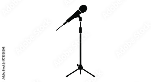 A black silhouette of a microphone on a stand against white