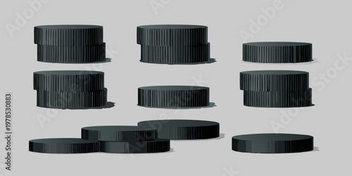 A collection of black cylindrical objects stacked and arranged in rows