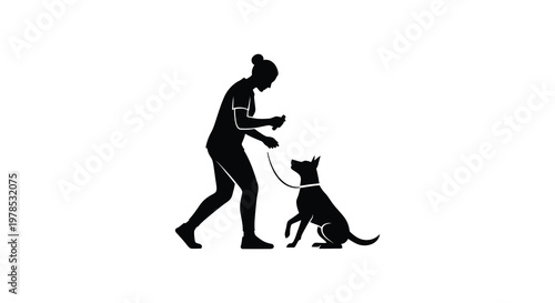 Woman interacting with a dog depicted in a striking black silhouette