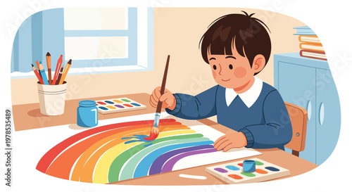 Boy paints a rainbow in bright colors at a desk with art supplies during the day at home