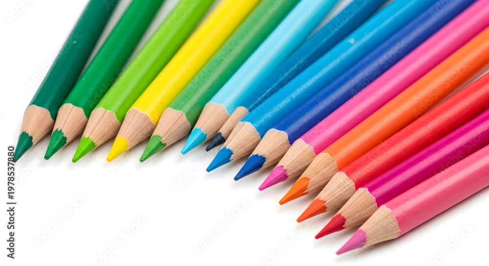 Fototapeta premium A collection of colorful pencils arranged in a rainbow pattern on a white background