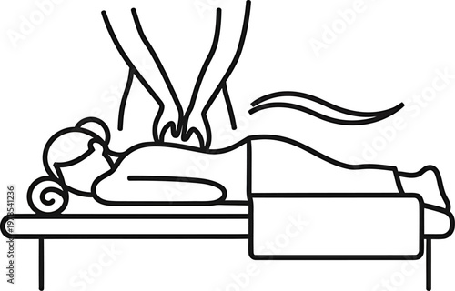 Patient lying on a massage table receiving a back treatment