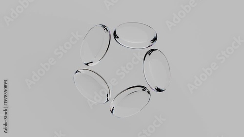 3D rendering of circular shapes rotating in various patterns over time