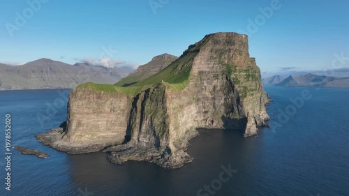 Drone shot of vertical cliffs of Kalsoy on Faroe Islands