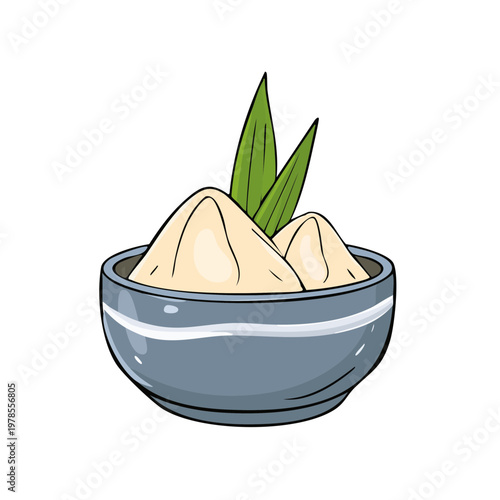 Bowl of creamy sweet dessert with green leaves for garnish