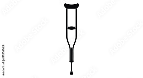 A black crutch stands isolated on a white background a striking silhouette