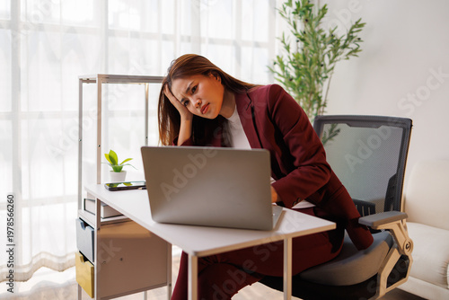 Фотография Stressed young woman dealing with overwork and burnout from job