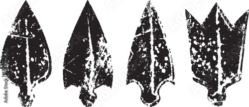 Vintage black arrowheads collection with rough texture isolated on white background