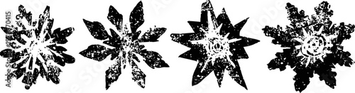 black and white grunge snowflakes with rough textured edges and varied star shapes