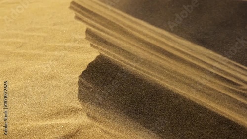 Wallpaper Mural Strong wind sweeps a sand storm over the edge of a desert dune. Moving sand particles create dynamic surface patterns. Extreme close up detail shot Torontodigital.ca