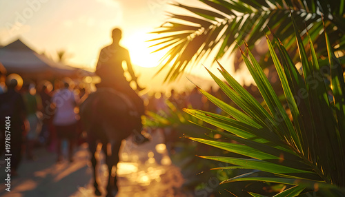 Silhouette of a person riding a horse at sunset with palm leaves in the foreground.
