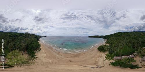 Spherical 360 panorama from above Magura Beach cove showing turquoise waters with coral reef patches sandy shoreline jungle headlands and coconut palms in Puerto Princesa Palawan