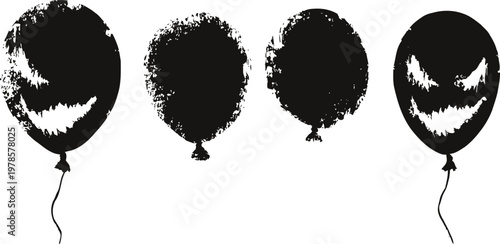 black halloween balloons with spooky carved faces in grunge concept for spooky decor
