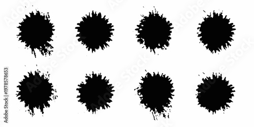 Eight abstract black ink splatters arranged in a grid pattern