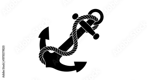 A sturdy black anchor wrapped with a rope lies on a surface.
