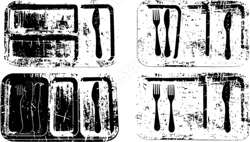 scratched and worn metal cutlery and tray sets with fork, knife, and spoon utensils